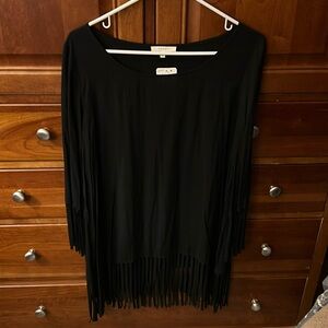 NWT amazing long black blouse. Fringed bottom and sleeves.